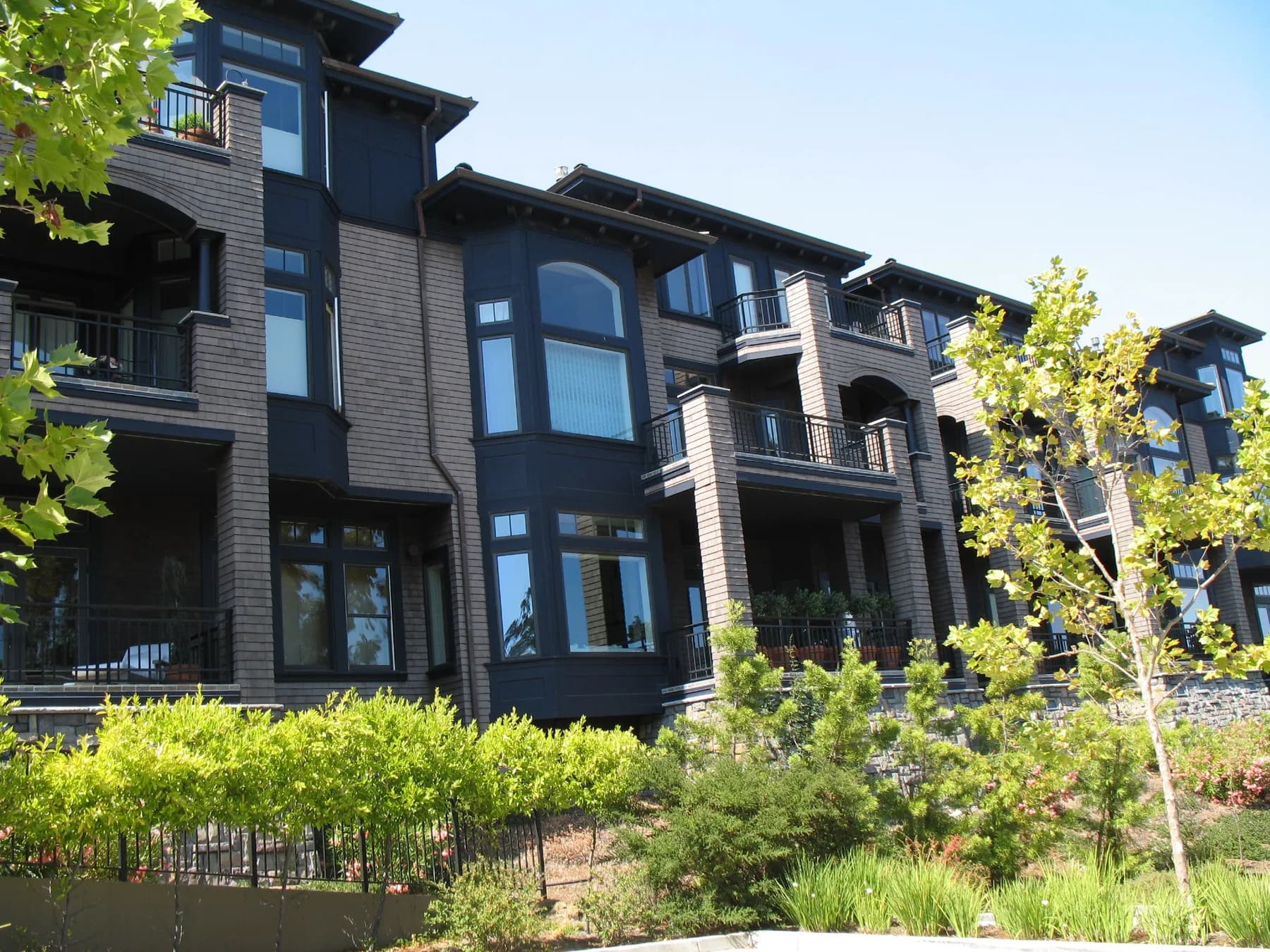 Multi-story shingle-clad condominium complex of the type involved in defect litigation