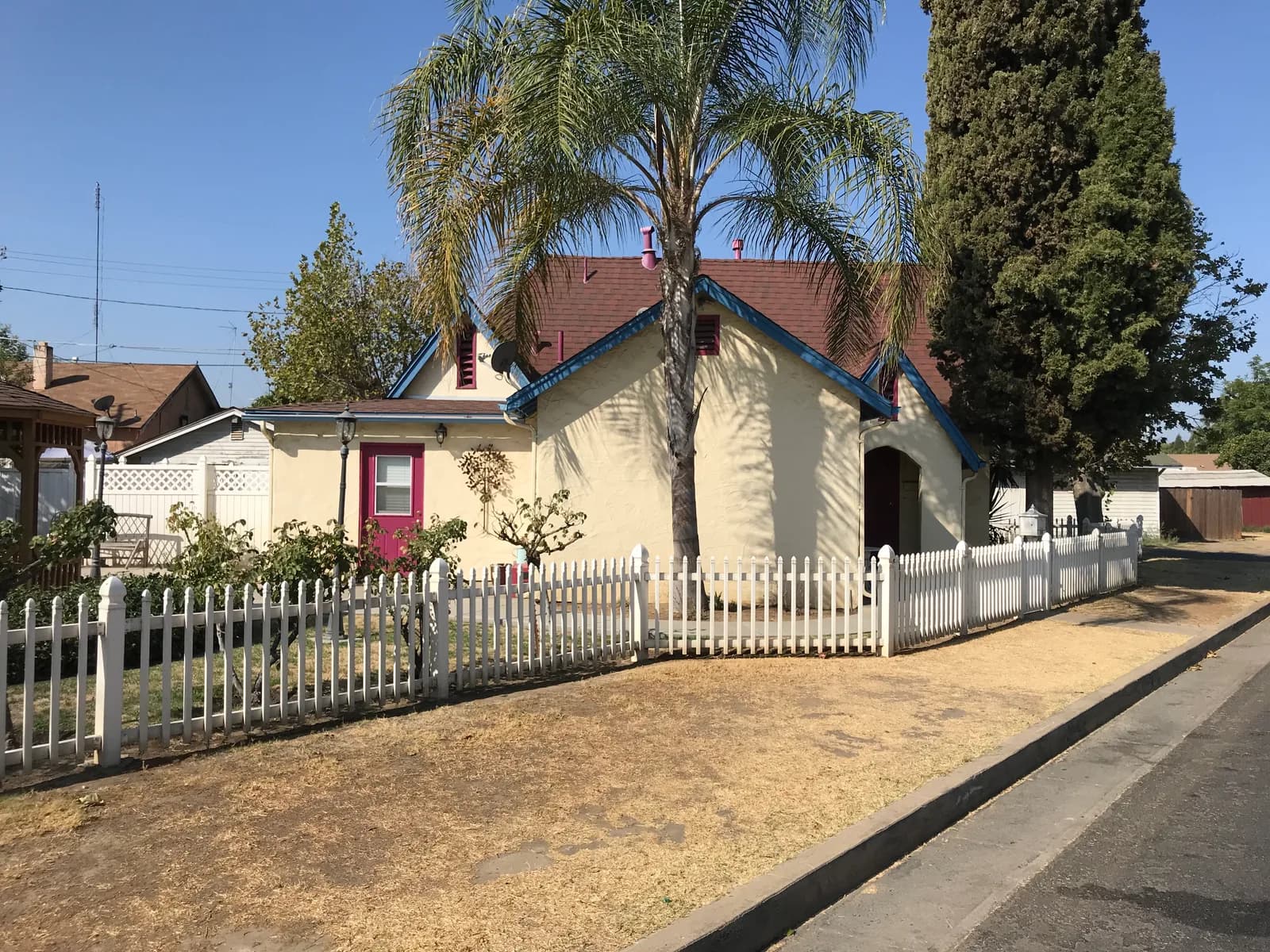 Single-family residence with picket fence documented during a site inspection