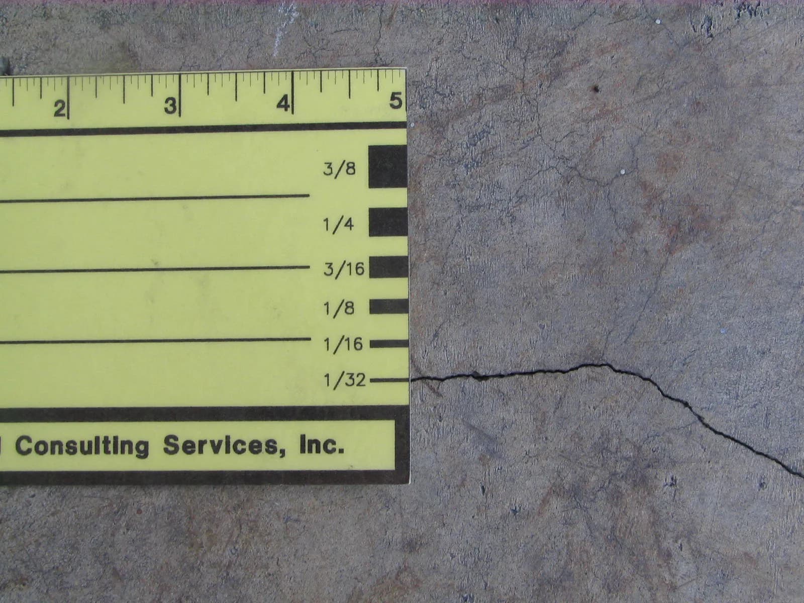 Close inspection of cracking in a concrete slab during a forensic investigation