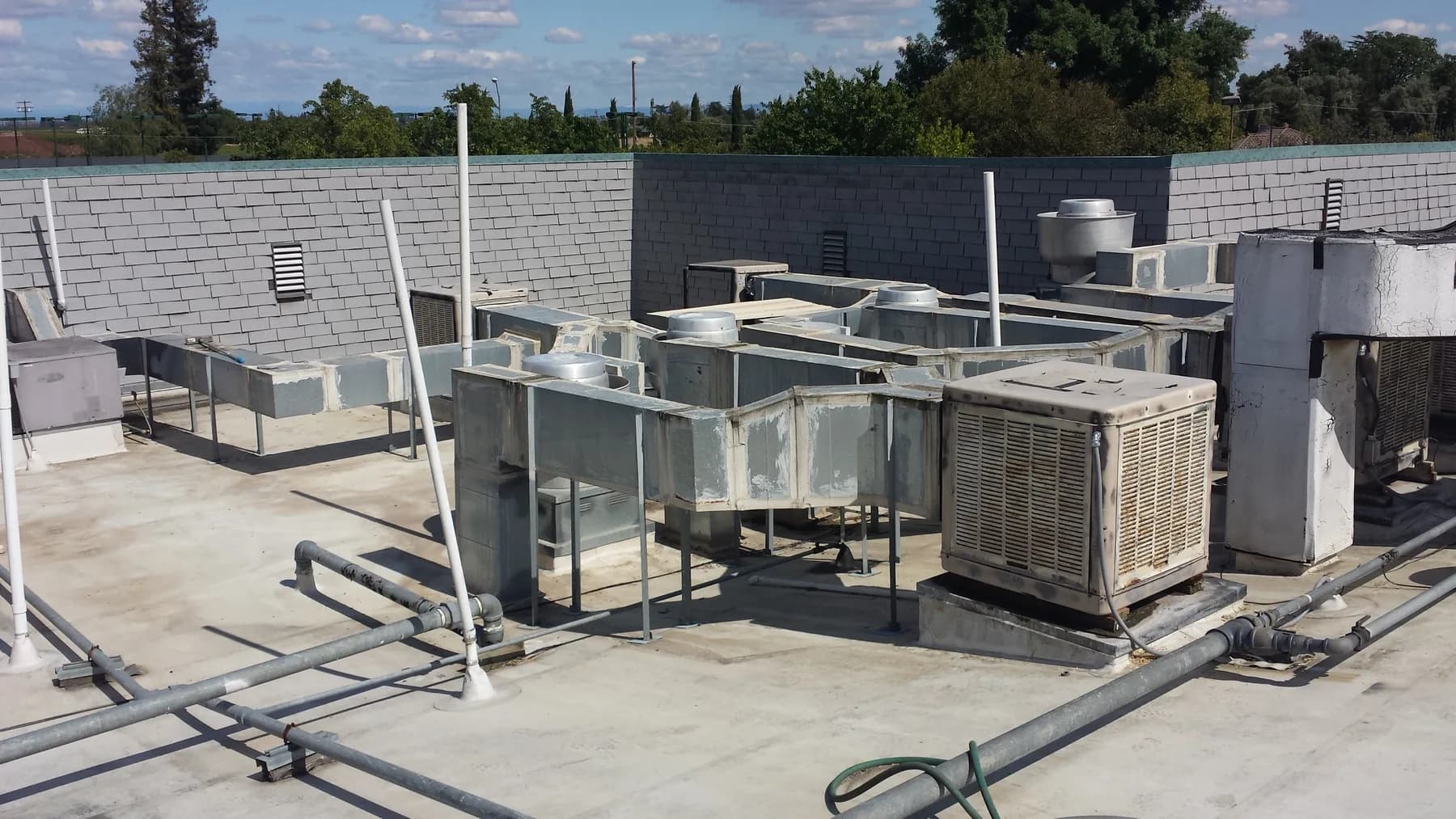 Rooftop mechanical equipment and ductwork examined during an MEP system evaluation